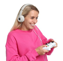 Photo of Happy woman in headphones playing video games with controller on white background