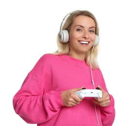 Photo of Happy woman in headphones playing video games with controller on white background