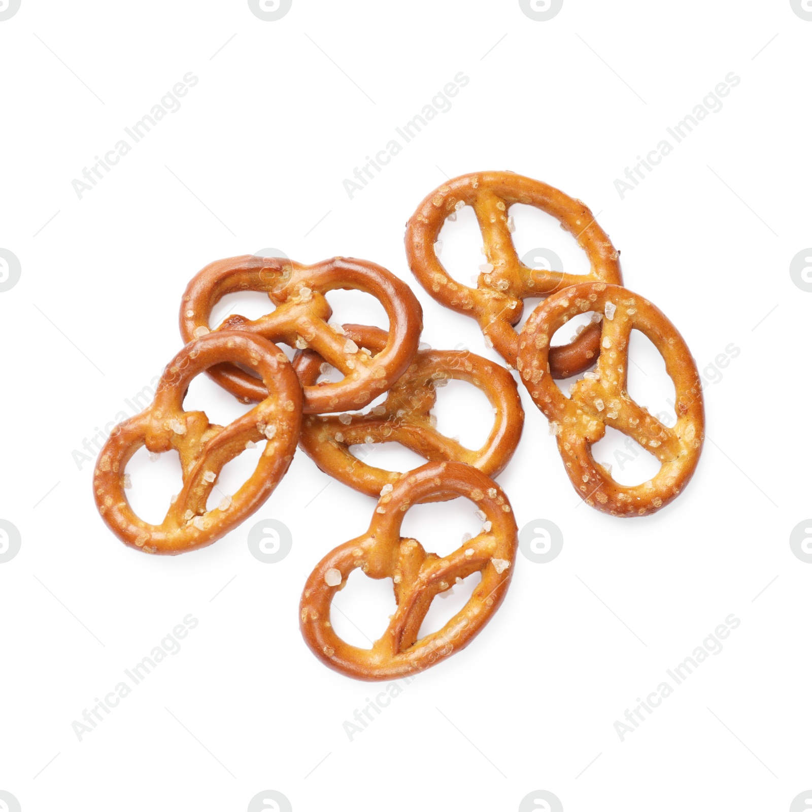 Photo of Many delicious pretzel crackers isolated on white, top view