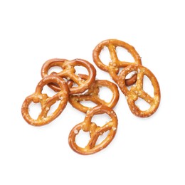 Photo of Many delicious pretzel crackers isolated on white, top view