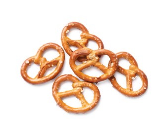 Photo of Many delicious pretzel crackers isolated on white, top view