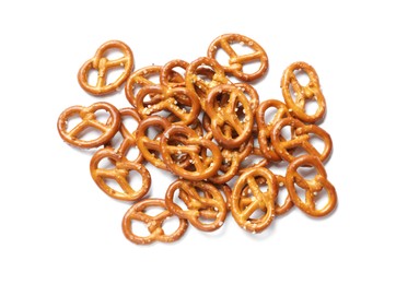 Photo of Many delicious pretzel crackers isolated on white, top view