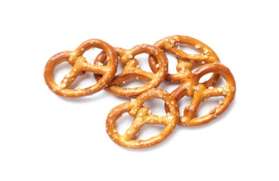 Photo of Many delicious pretzel crackers isolated on white, top view