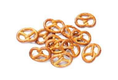 Many delicious pretzel crackers isolated on white, top view