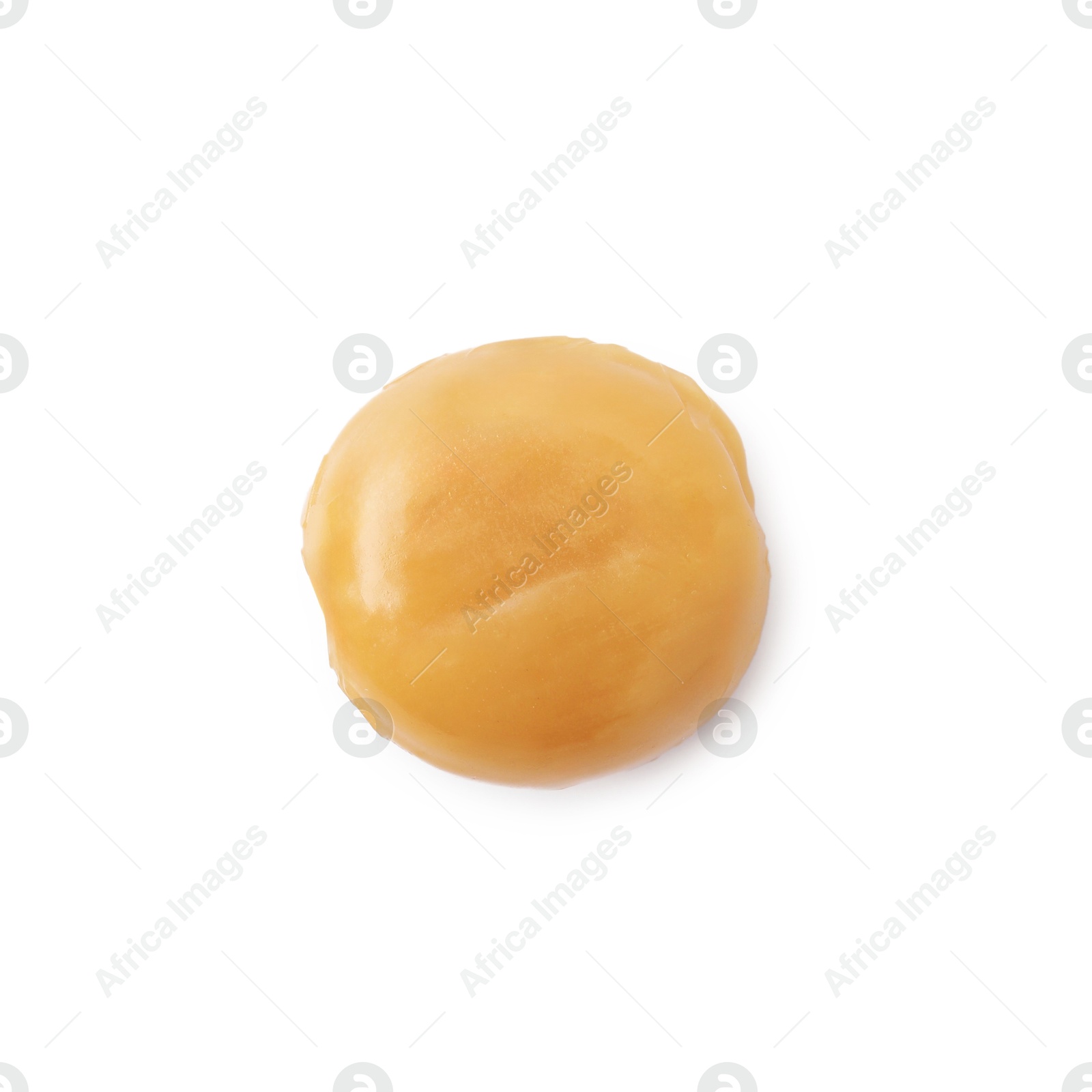 Photo of Tasty hard toffee candy isolated on white, top view