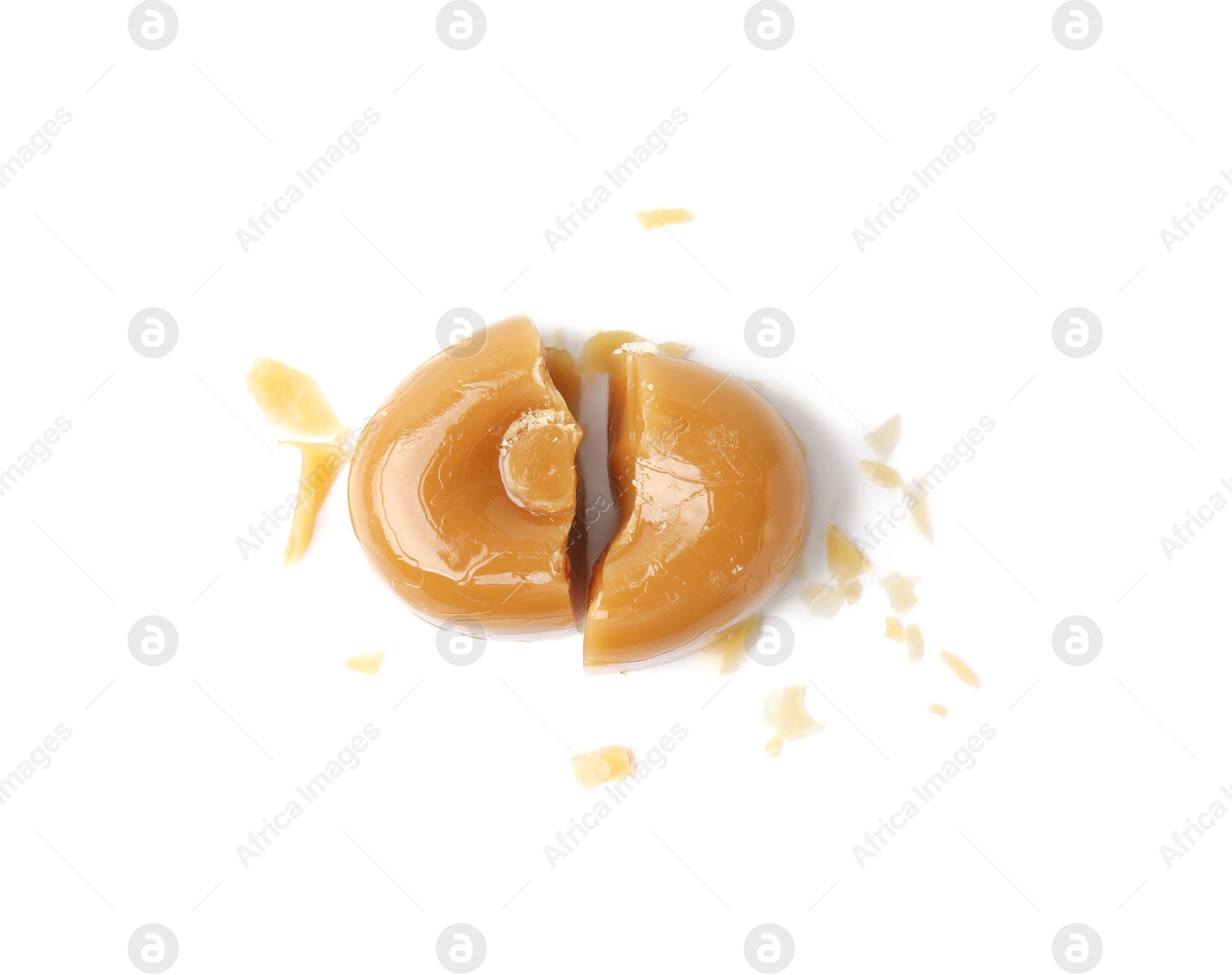 Photo of Pieces of tasty hard toffee candy isolated on white, top view