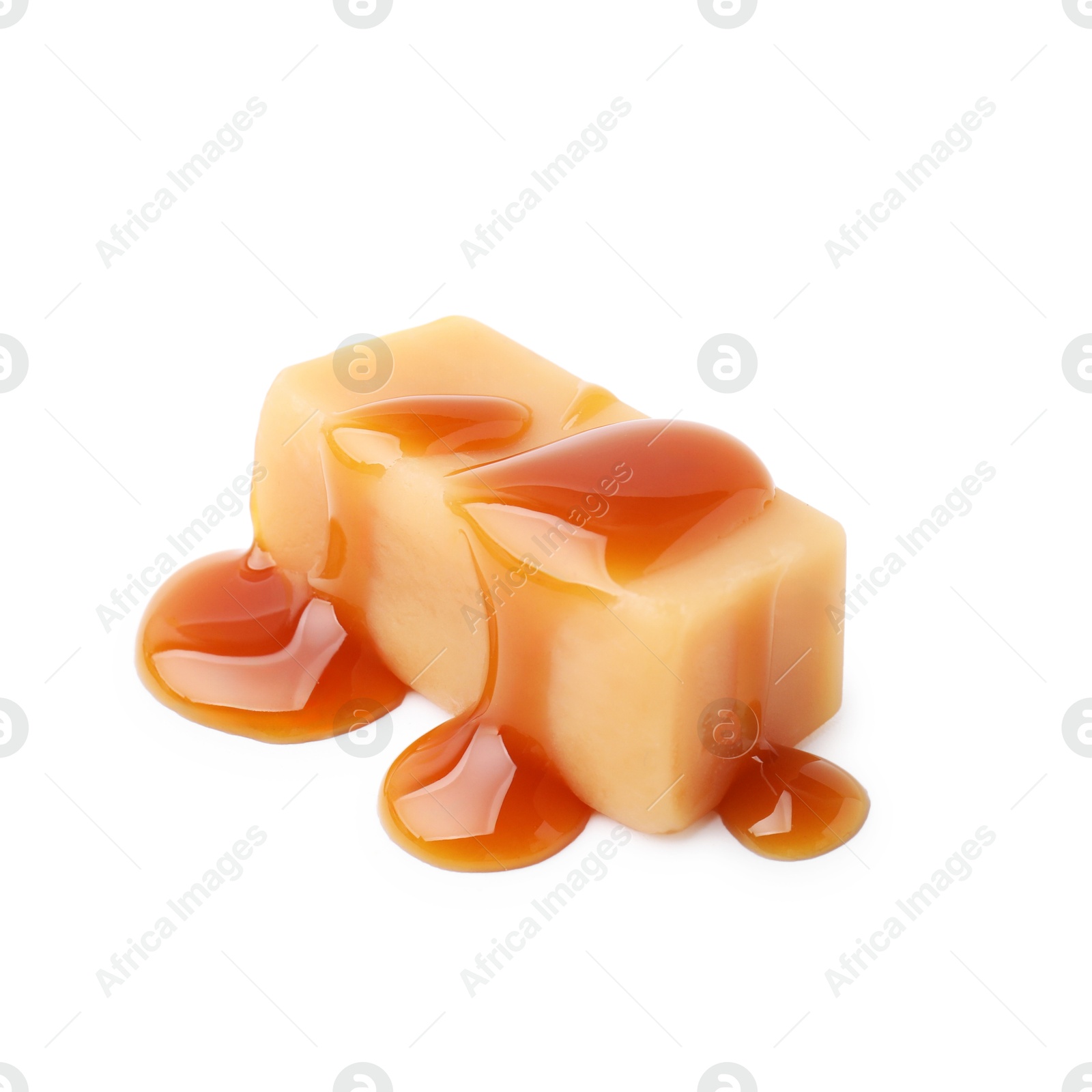 Photo of Tasty candy with caramel sauce isolated on white