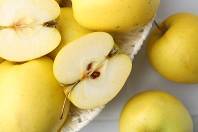 Fresh ripe yellow apples on white table, flat lay