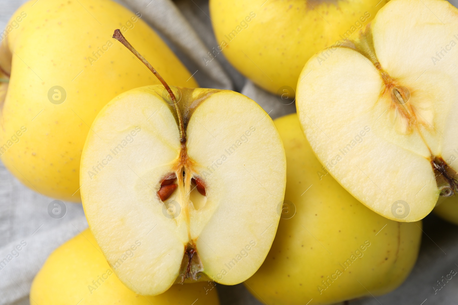 Photo of Fresh ripe yellow apples on table, closeup