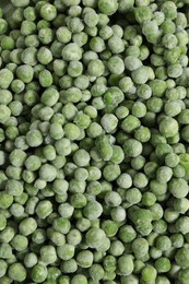 Photo of Frozen green peas as background, top view