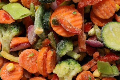 Photo of Mix of frozen vegetables as background, top view