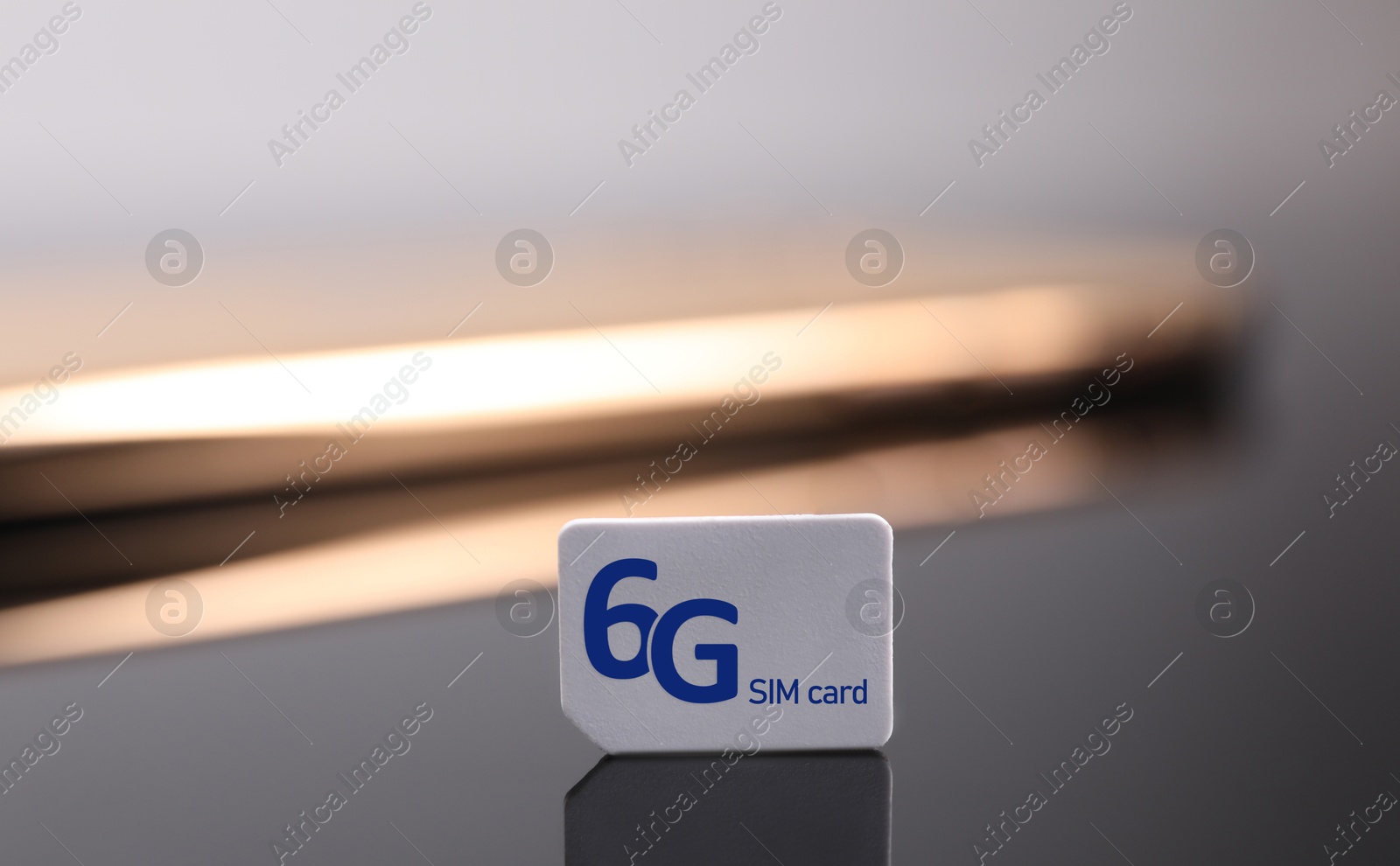 Image of 6G SIM card on dark background, closeup