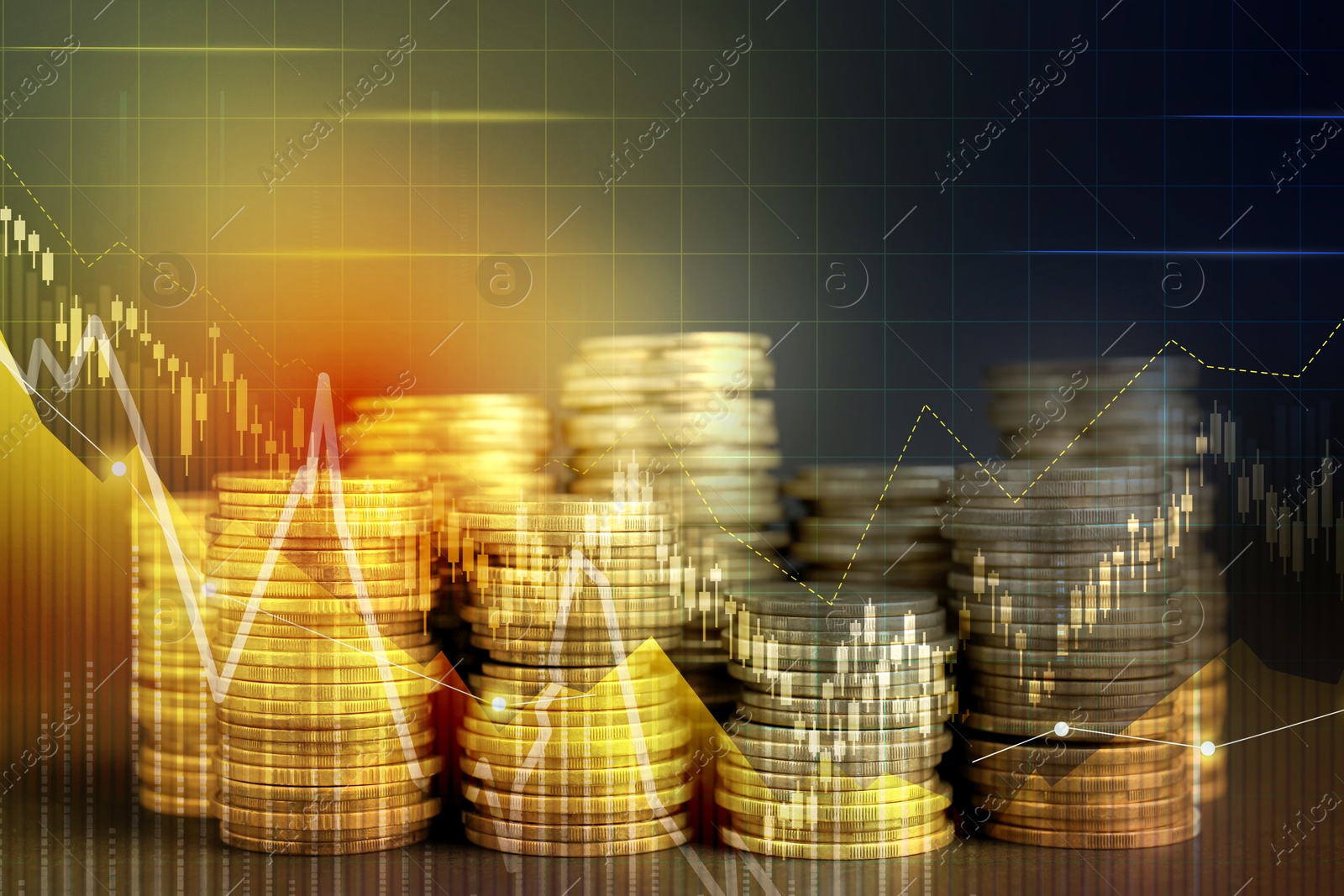 Image of Currency trading. Stacked coins and graphs, color toned