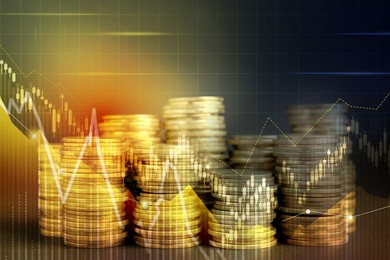 Image of Currency trading. Stacked coins and graphs, color toned