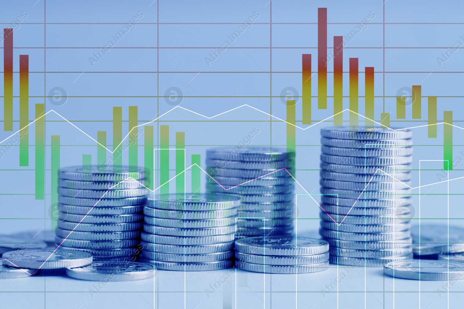 Image of Currency trading. Stacked coins and graphs, color toned