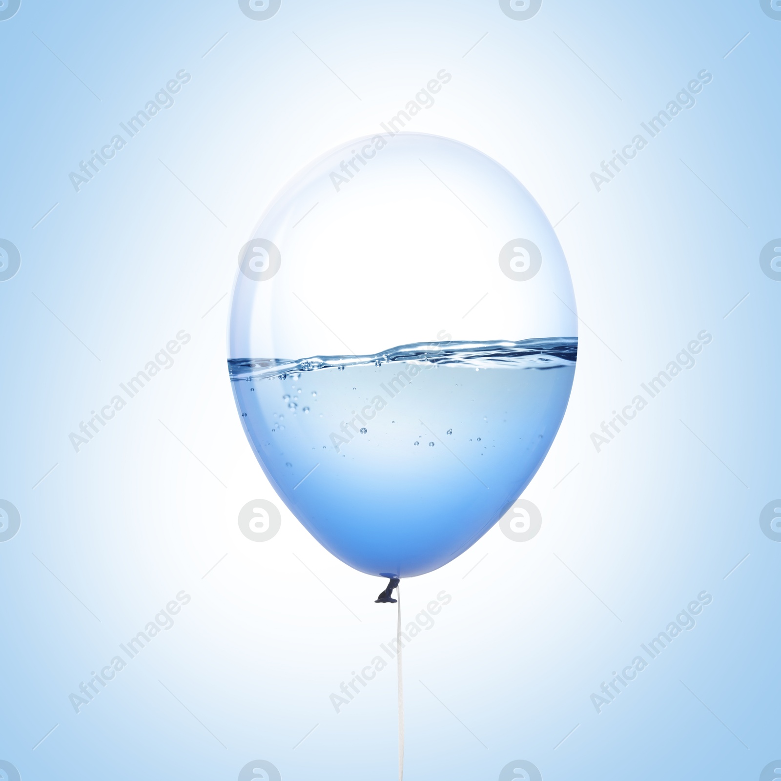 Image of Balloon with water inside on light blue background