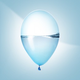 Image of Balloon with water inside on light blue background