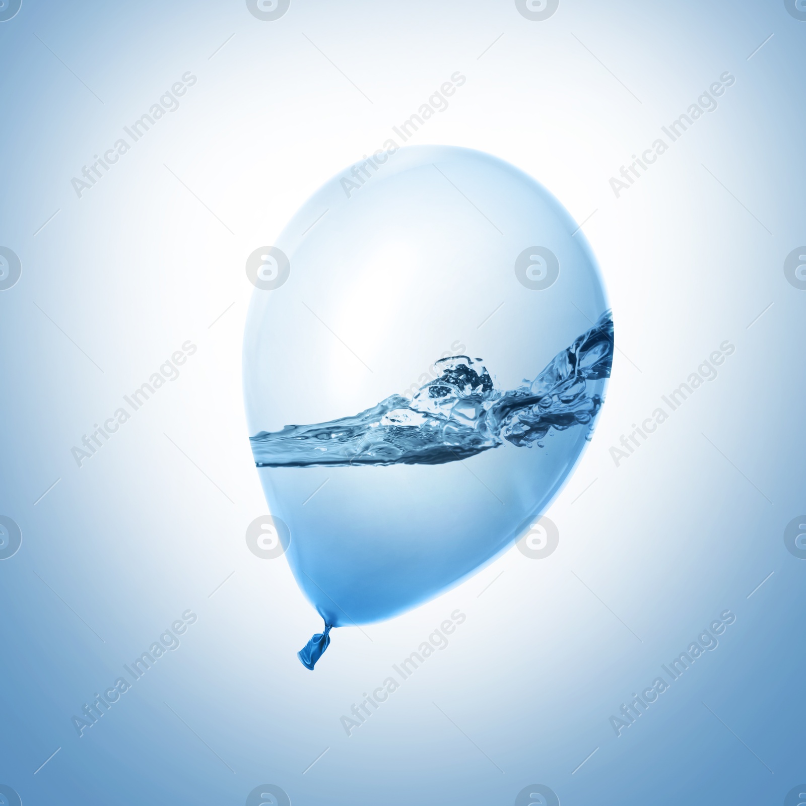 Image of Balloon with water inside on light blue background