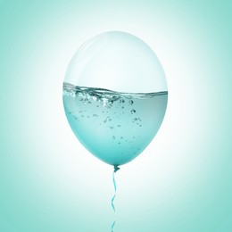 Image of Balloon with water inside on turquoise background