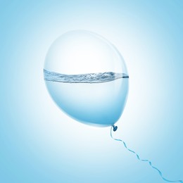 Image of Balloon with water inside on light blue background