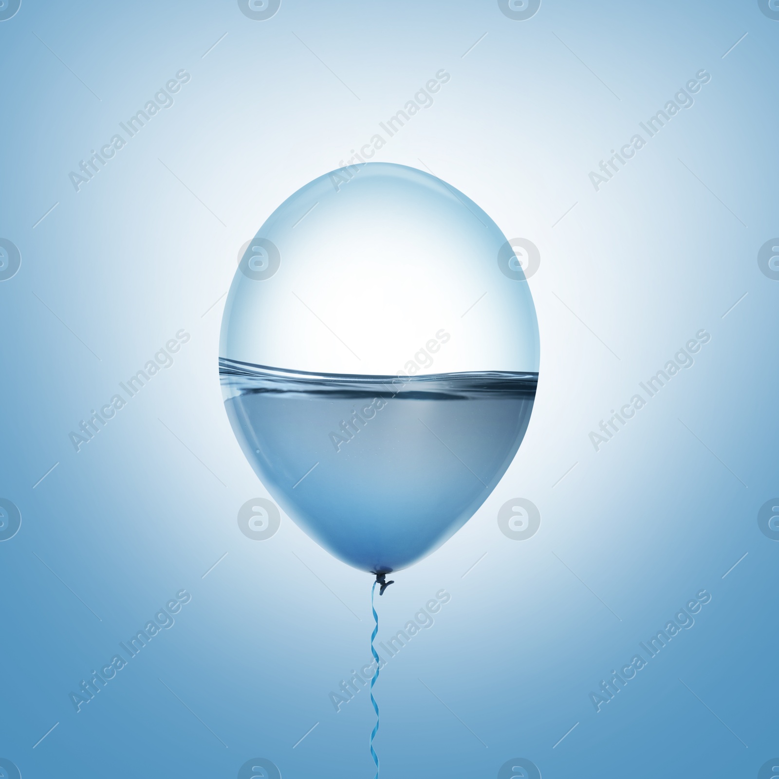 Image of Balloon with water inside on light blue background