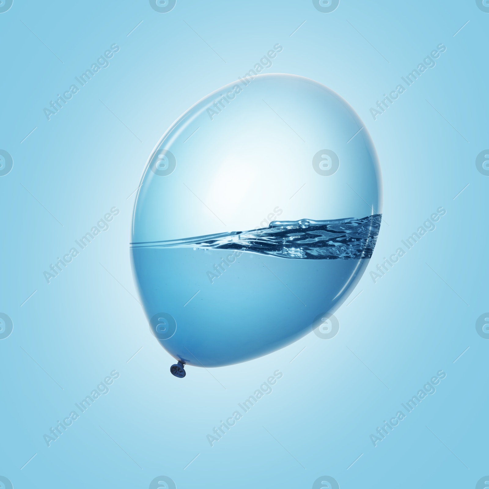 Image of Balloon with water inside on light blue background