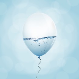 Image of Balloon with water inside on light blue background