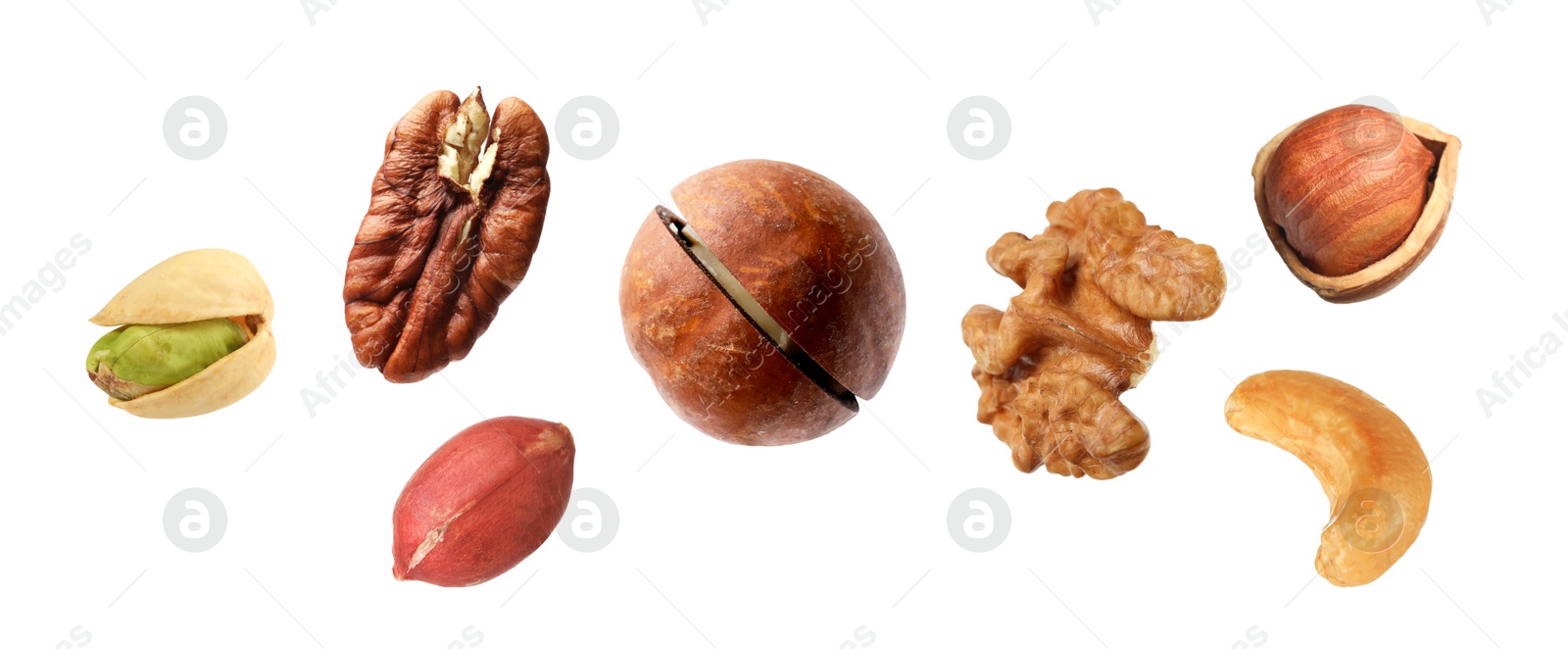 Image of Macadamia and other nuts in air on white background