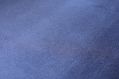 Photo of Texture of dark blue silk fabric as background, closeup