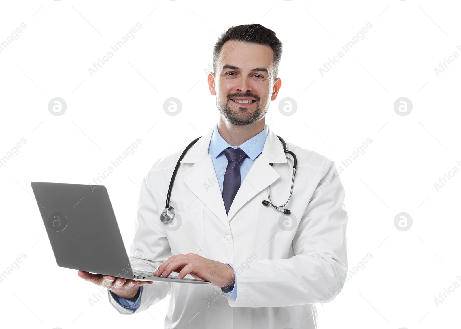 Photo of Smiling doctor with stethoscope using laptop on white background