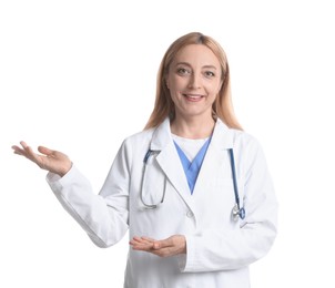 Doctor with stethoscope showing something on white background