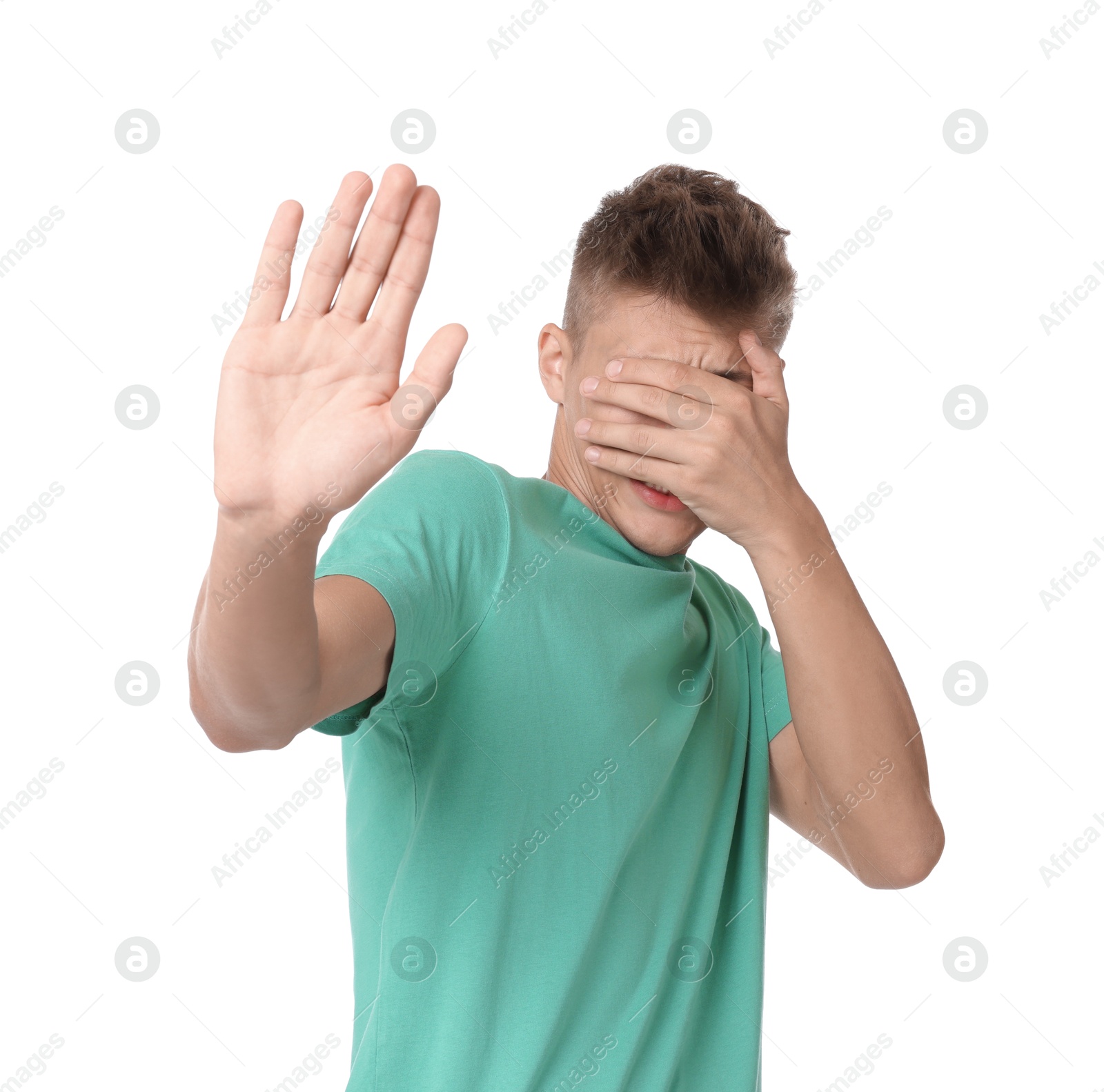 Photo of Portrait of scared young man on white background