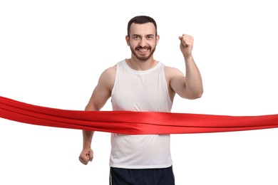 Handsome young man crossing red finish line on white background