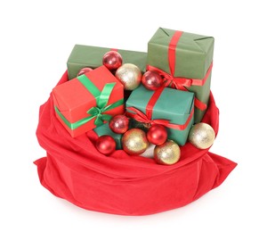 Santa Claus bag full of presents and decorative balls isolated on white