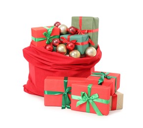 Photo of Santa Claus bag full of presents and decorative balls isolated on white