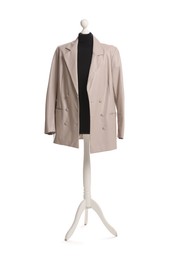 Female mannequin with beige jacket isolated on white