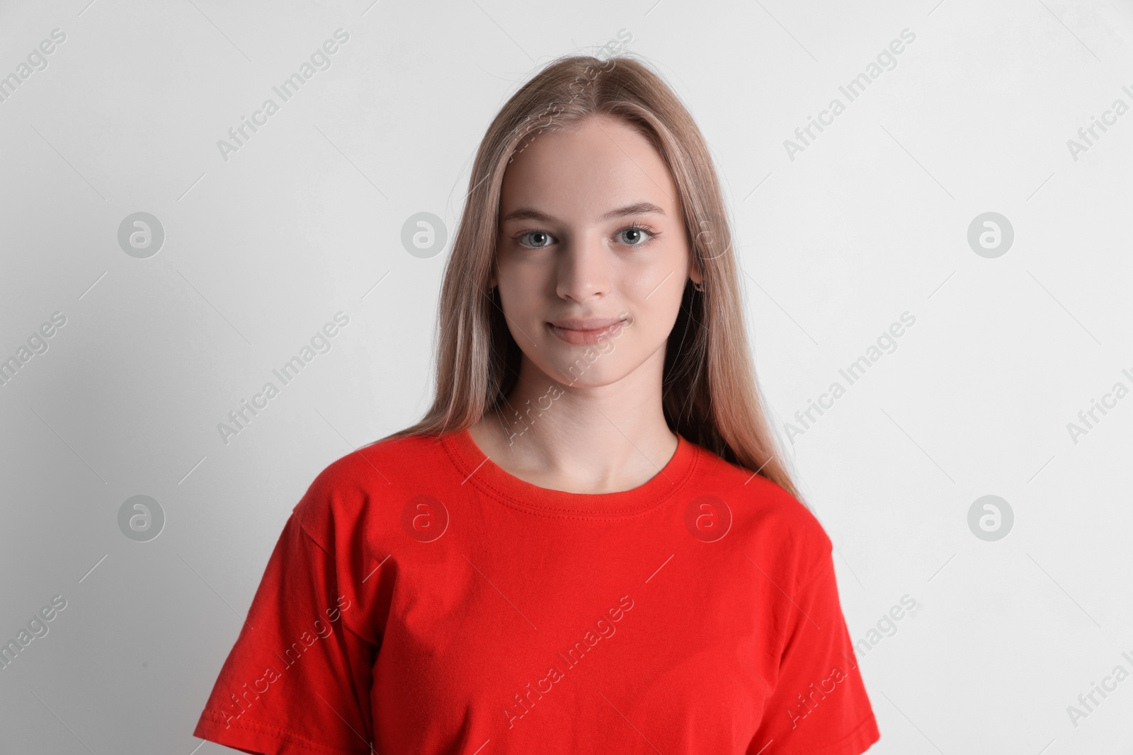 Photo of Portrait of teenage girl on white background