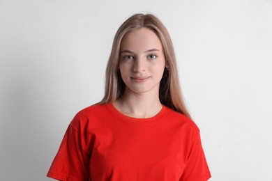 Portrait of teenage girl on white background