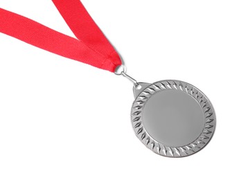 Photo of One silver medal isolated on white, above view