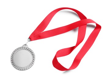 Photo of One silver medal isolated on white, top view