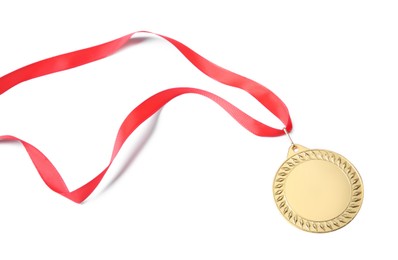 Photo of One golden medal isolated on white, above view