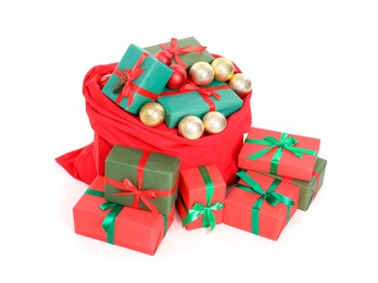 Photo of Santa Claus bag full of presents and decorative balls isolated on white