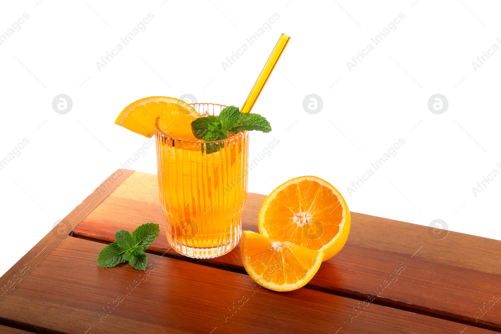 Photo of Glass of tasty refreshing drink with straw and fresh fruit on wooden table against white background