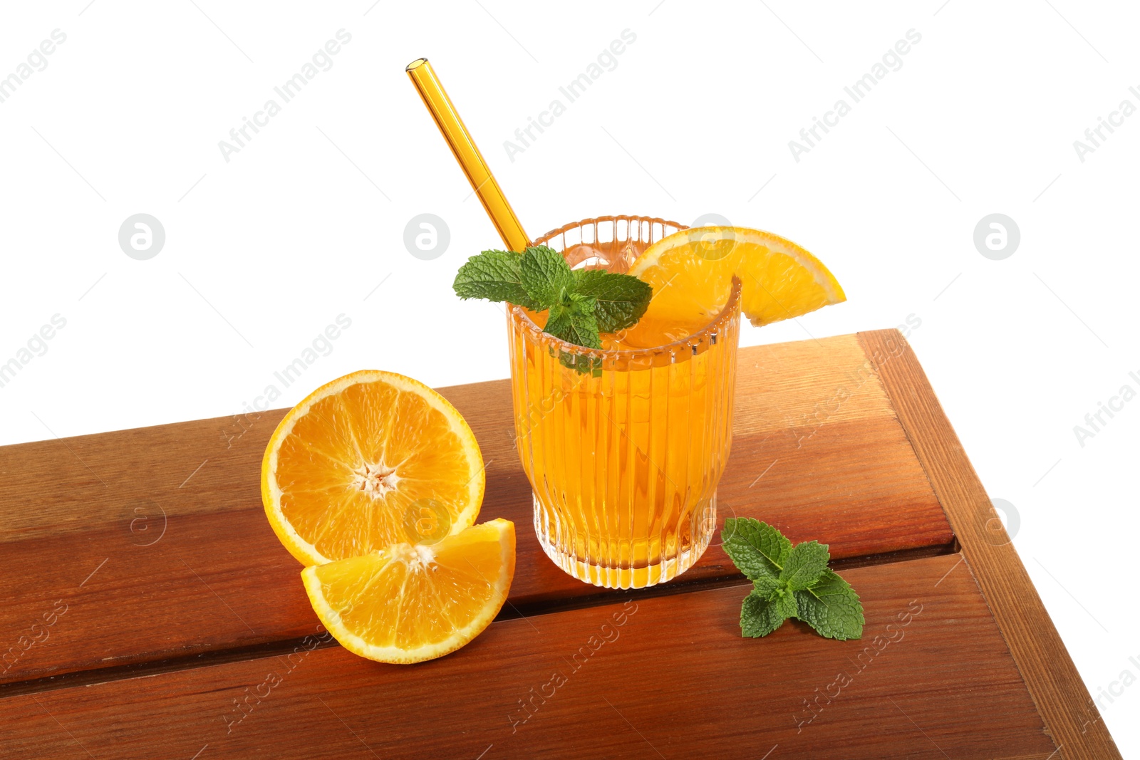 Photo of Glass of tasty refreshing drink with straw and fresh fruit on wooden table against white background