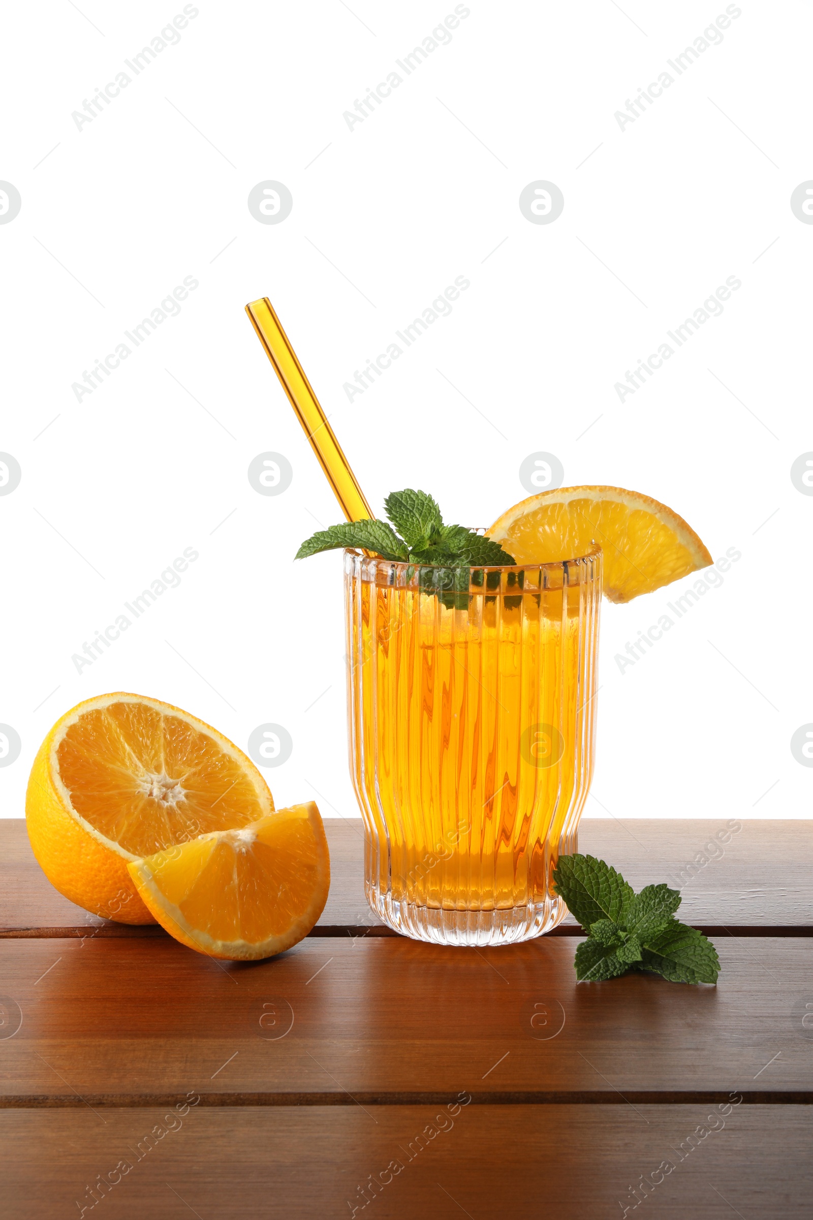 Photo of Glass of tasty refreshing drink with straw and fresh fruit on wooden table against white background