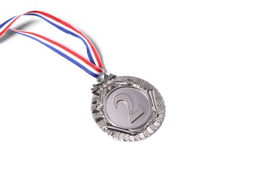 Photo of One silver medal with ribbon isolated on white