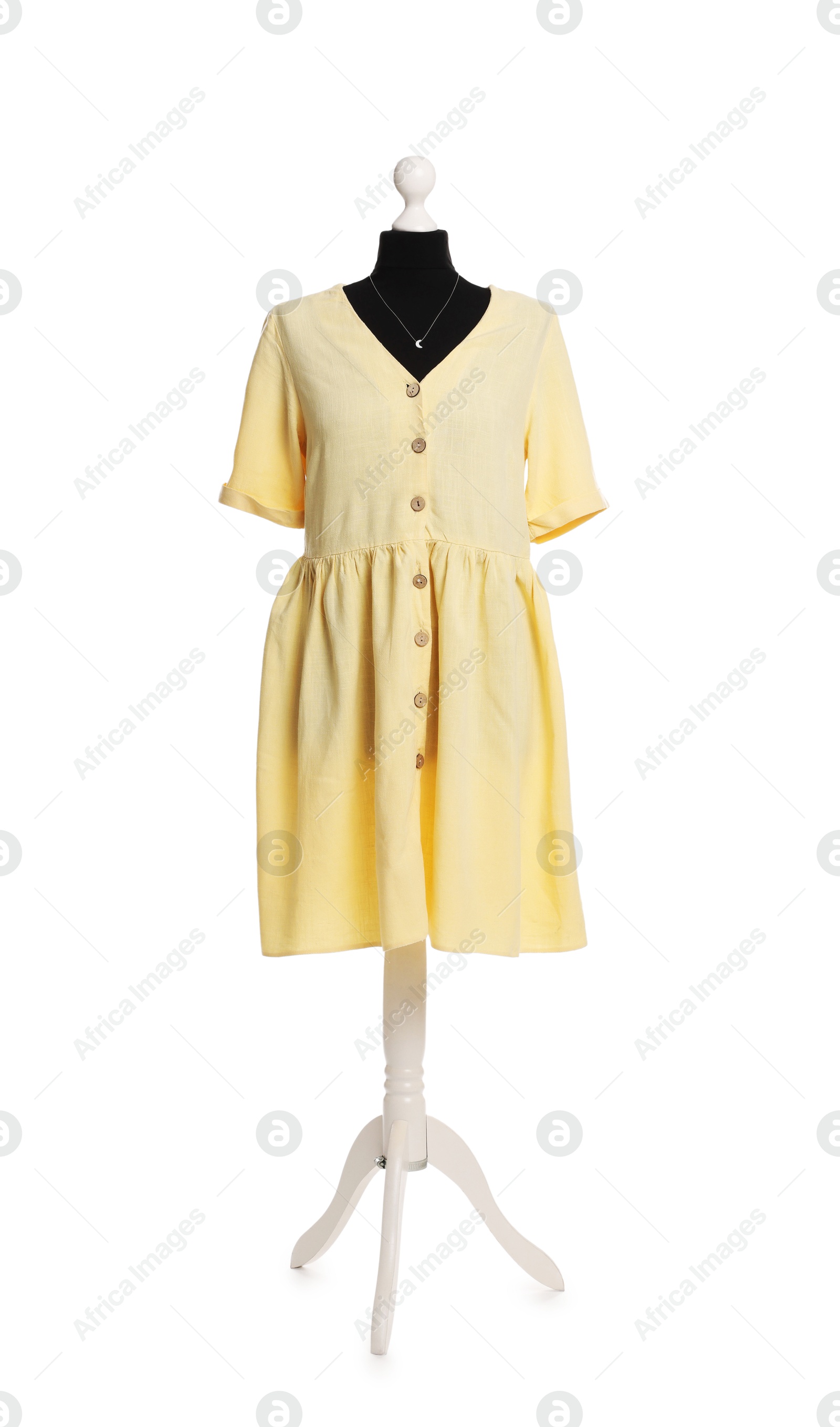 Photo of Female mannequin with stylish yellow dress isolated on white