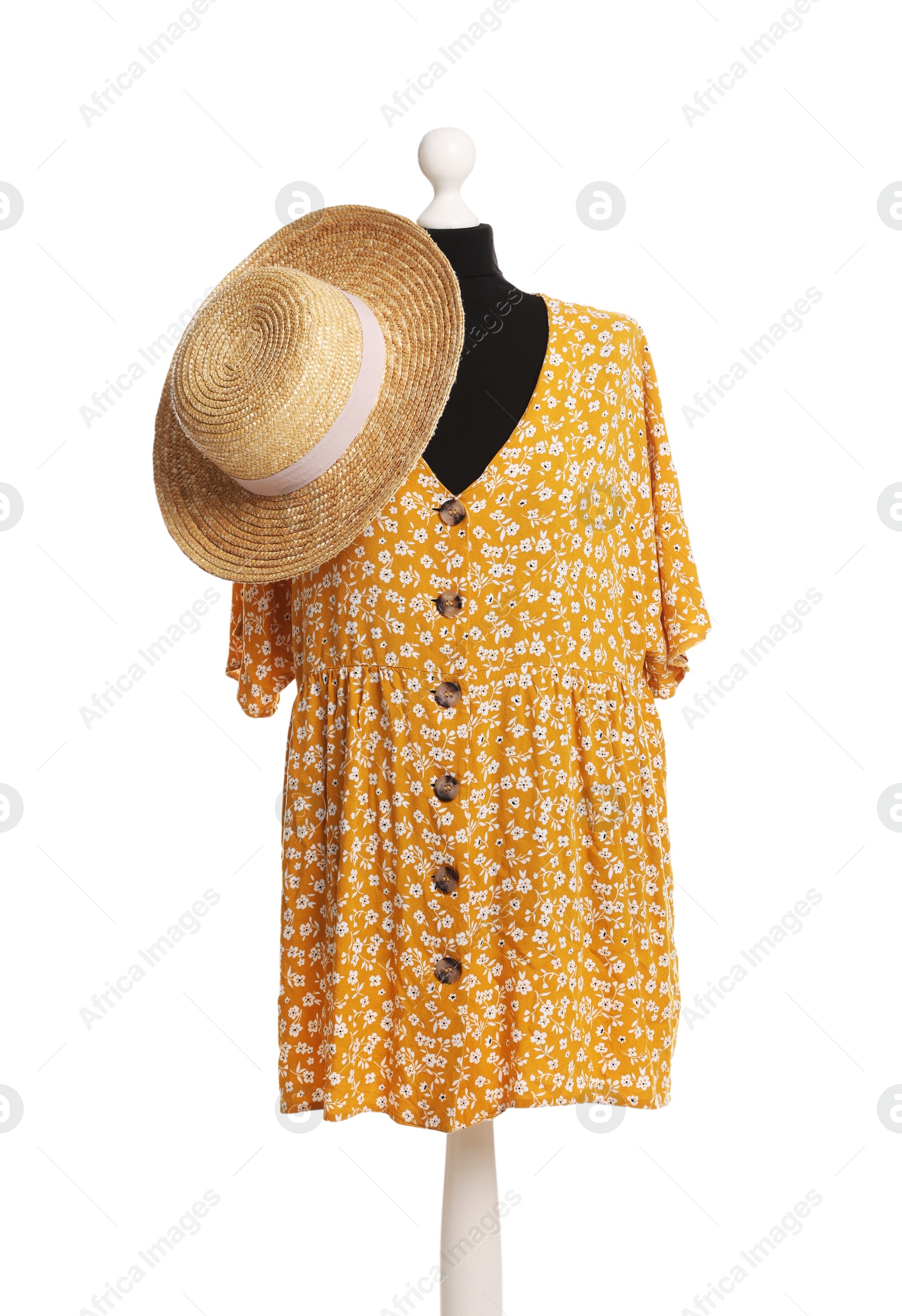 Photo of Female mannequin with stylish yellow dress and straw hat isolated on white