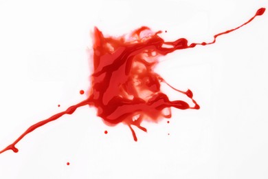 Photo of Stain of blood on white background, top view