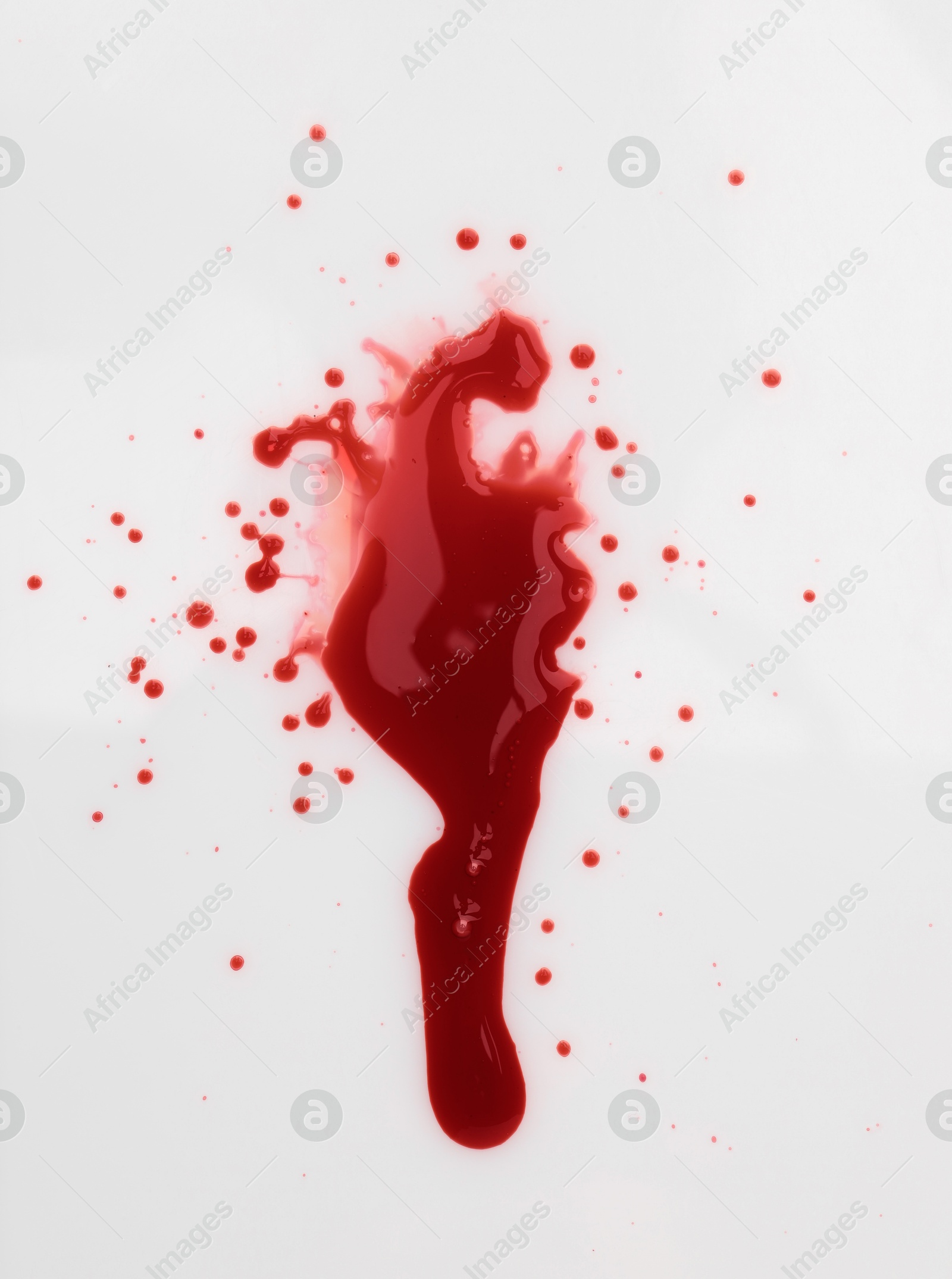 Photo of Stain of blood on white background, top view